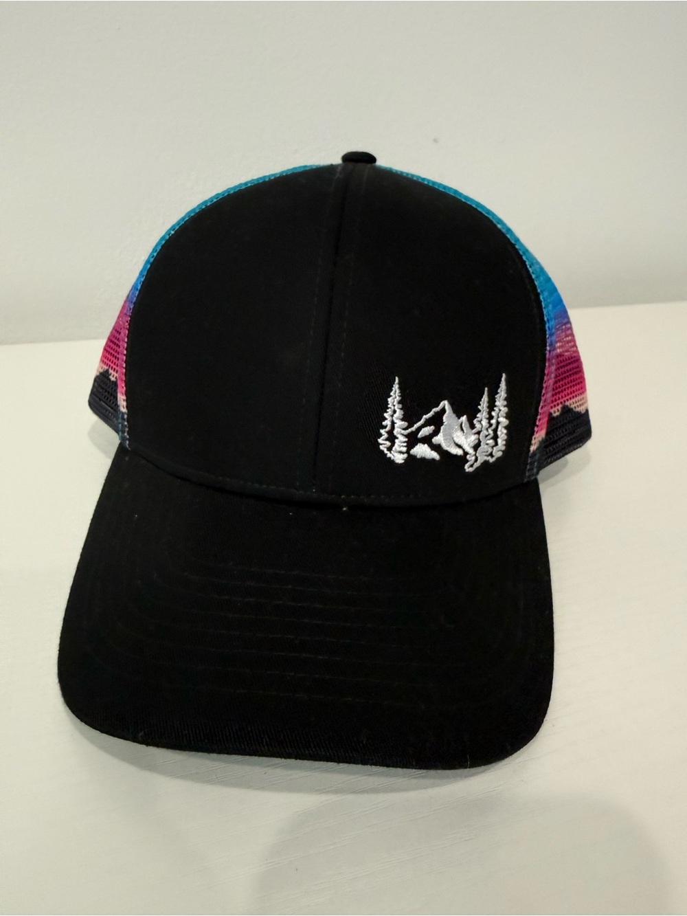 Black Trucker Hat with Mountain & Trees Embroidery and Colorful Mesh; worn 1x.
